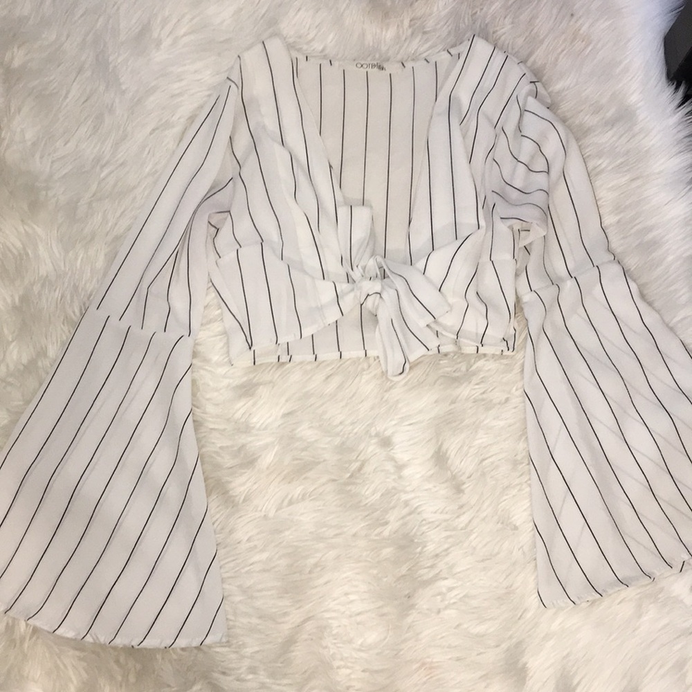 Tie knot bell sleeve shirt.